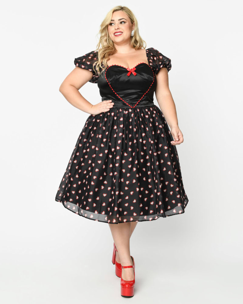 Front of a model wearing a size 2X Unique Vintage Plus Size Black Cupid's Lover Swing Dress in Black by Unique Vintage. | dia_product_style_image_id:325109